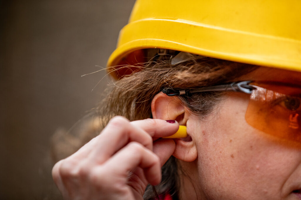 Adult women using ear protection to Prevent Hearing Loss